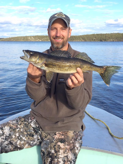 fisherman in canada with walleye